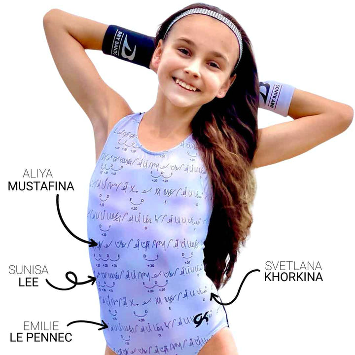 Front of DRYbands, Champion Routines leotard featuring Holotek fabric which reflects the light and gives off a rainbow hue.  Routines from olympians Aliya Mustafina, Sunisa Lee, Emilie Le Pennec, Svetlana Khorkina, Olympic gold medal champions, on the uneven bars