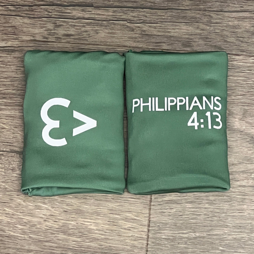 Sage DRYbands, customizable wristbands with white block writing for gymnasts